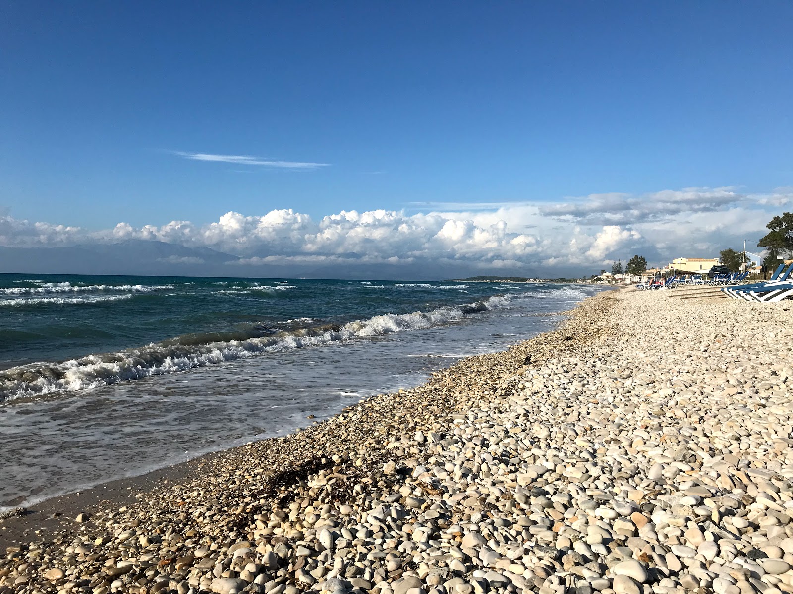 Photo of Roda beach III with long straight shore