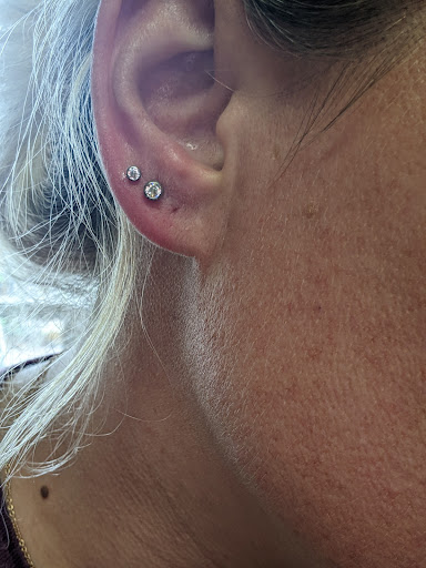 Find sunflower tattoo ideas for females for your next unique tattoo in Minocqua at Lotus Piercing