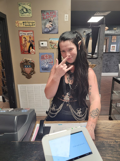 Find in between breast tattoo ideas for your next unique tattoo in Saraland at Exit 13 Tattoo