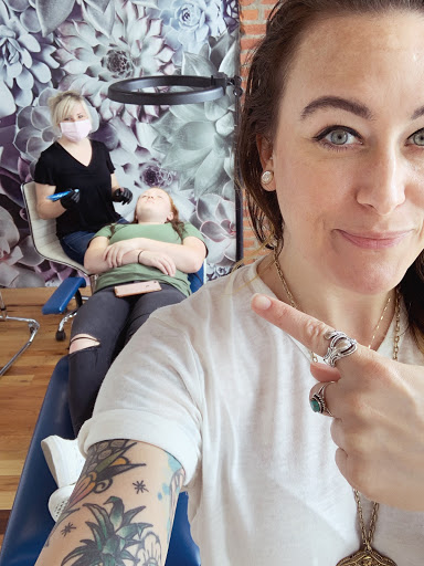 Explore tattoo ideas for women's lower back, creative tattoo ideas in Columbus, available at Pretty In Ink