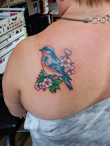 Explore one piece tattoos ideas, creative tattoo ideas in Angola, available at SafeHouse Ink