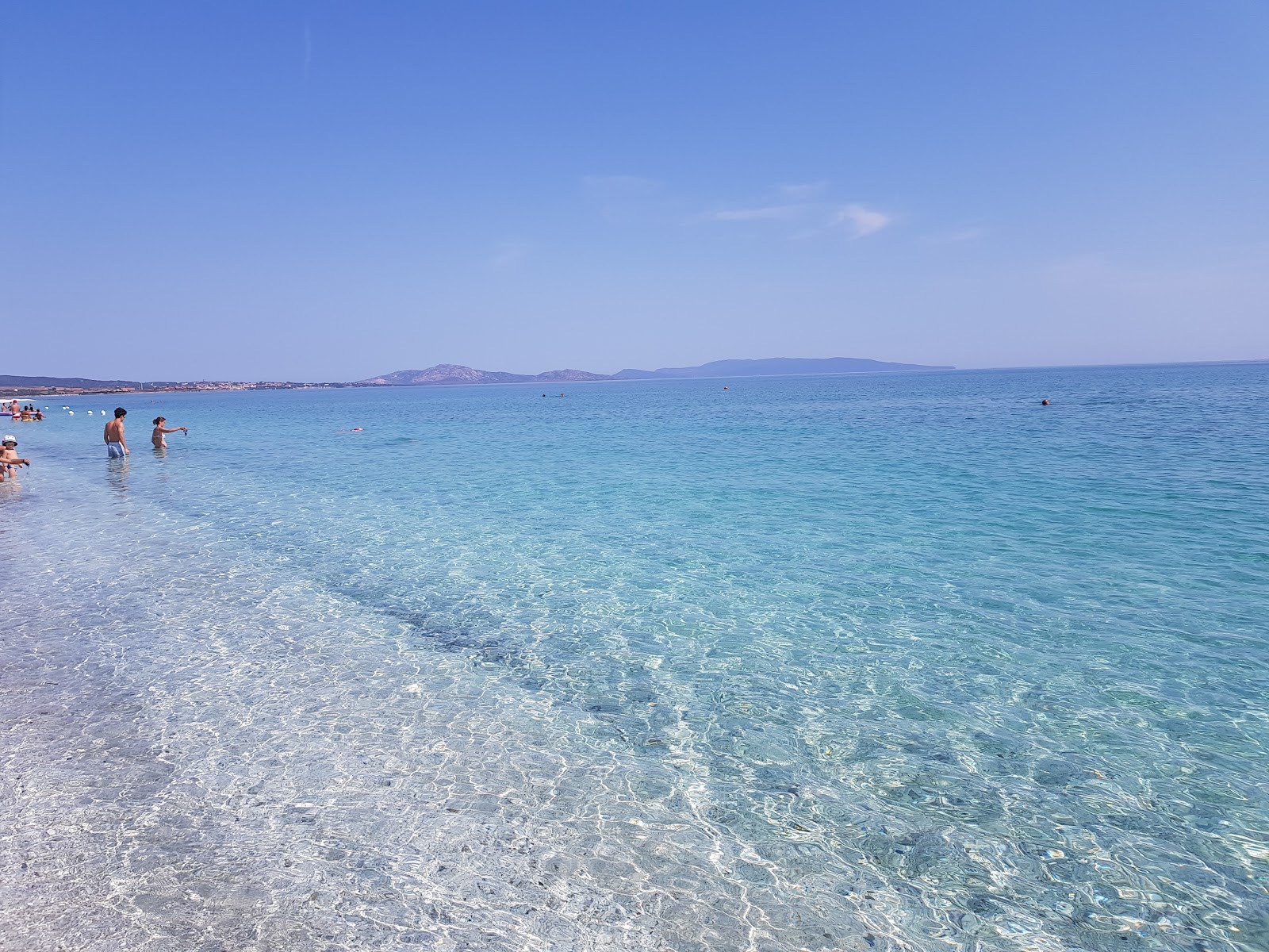 Foto van Pazzona Strand met turquoise puur water oppervlakte
