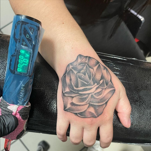 Explore upper arm tattoo ideas for guys, creative tattoo ideas in Mastic, available at Infinity Tattoo