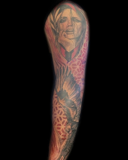 Explore cross tattoo ideas for guys, creative tattoo ideas in Green Cove Springs, available at Under Your Skin Tattoos