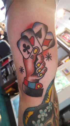 Explore ironman triathlon tattoo ideas, creative tattoo ideas in Reno, available at Aces Tattoo