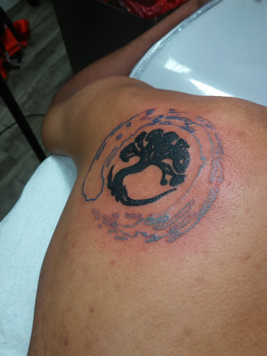 Explore christmas tree tattoo ideas, creative tattoo ideas in Buford, available at Killer Ink