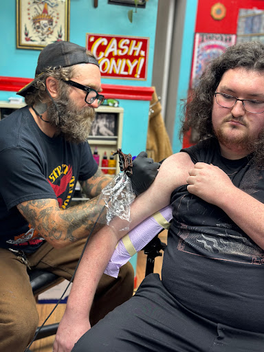 Explore wrestling tattoo ideas, creative tattoo ideas in Dallas, available at Heart In Hand Lower Greenville