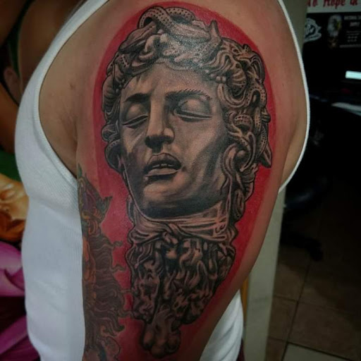 Explore bowhunting tattoo ideas, creative tattoo ideas in Seattle, available at Obsidian Heart Ink