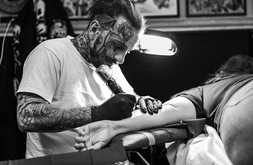 Explore arrow tattoo ideas for men, creative tattoo ideas in Orange Park, available at Big City Tattoo and Piercing