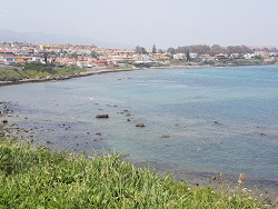 Foto von Playa de el Chinarral und die siedlung