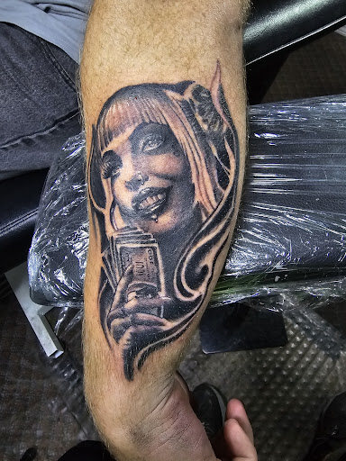 Explore rhino tattoo ideas, creative tattoo ideas in Angola, available at Hoodlum Ink