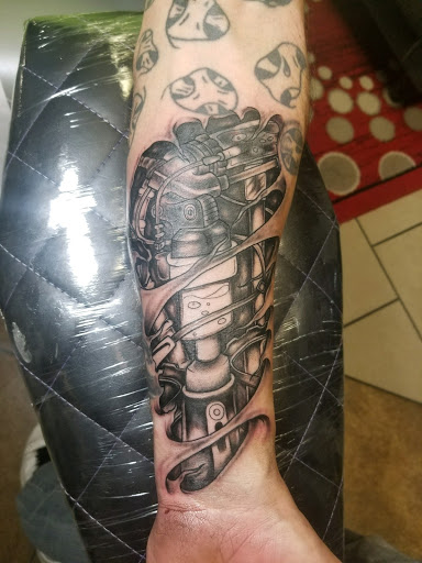 Explore ariana grande tattoo ideas, creative tattoo ideas in Bloomington, available at Iron & Ink Custom Tattoo And piercing.