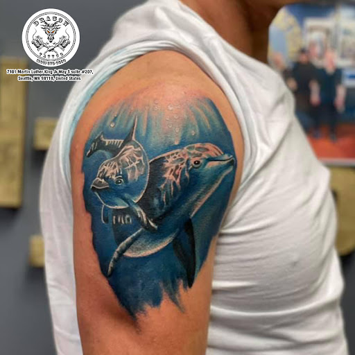 Explore mens tricep tattoo ideas, creative tattoo ideas in Seattle, available at Dragon Tattoo