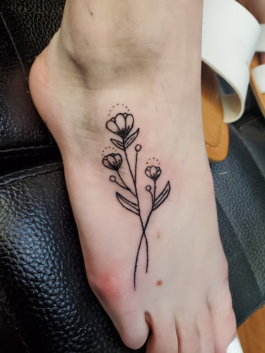 Explore floral arm tattoo ideas, creative tattoo ideas in Cocoa, available at Rorschach Tattoo Shop and Piercing Studio