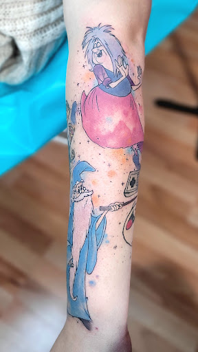 Explore ladies back tattoo ideas, creative tattoo ideas in Benton, available at Spectrum Tattoo