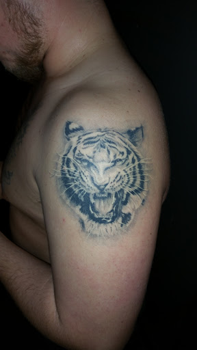 Explore warhammer 40k tattoo ideas, creative tattoo ideas in Foley, available at Black Sheep Custom Tattoos and Piercings