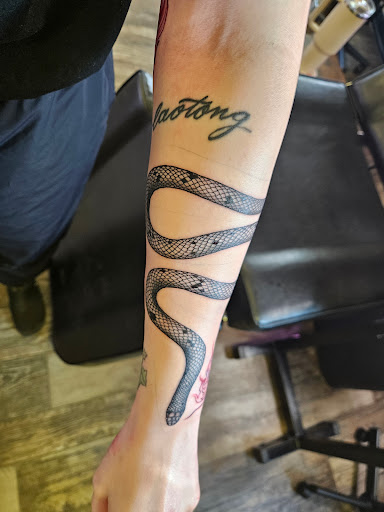 Explore ear tattoo ideas for women, creative tattoo ideas in Maple Lake, available at Earth Child Tattoo