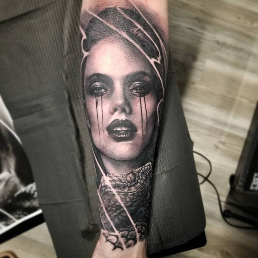 Explore above the knee tattoo ideas, creative tattoo ideas in Utica, available at Watchtower Tattoo Company