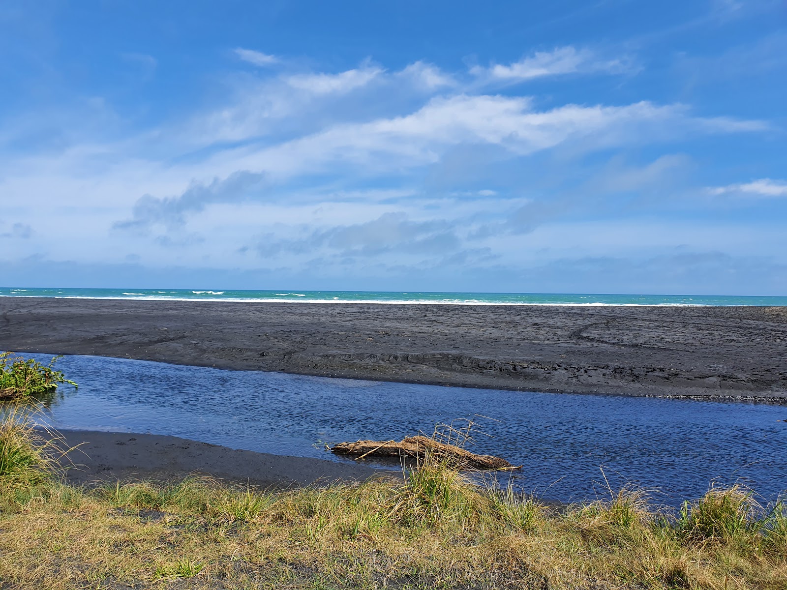 Ruapuke Beach的照片 带有碧绿色水表面