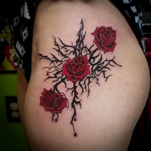 Explore book dragon tattoo ideas, creative tattoo ideas in Kingsport, available at Ink-a-zoid Tattoos & Piercings