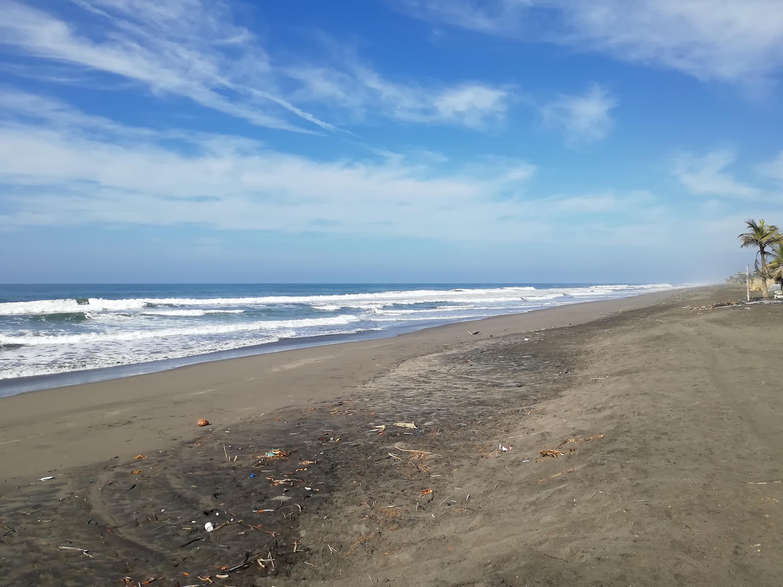 Foto de Costa Azul beach com areia cinza superfície