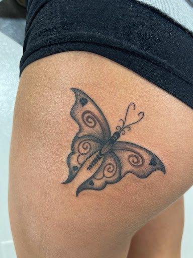 Explore dove tattoo ideas, creative tattoo ideas in Orange, available at Top Floor Tattoo Studio