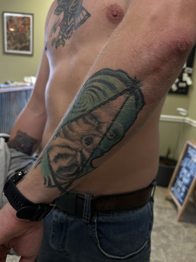 Explore bass fish tattoo ideas, creative tattoo ideas in Nashville, available at RedBird Tattoo