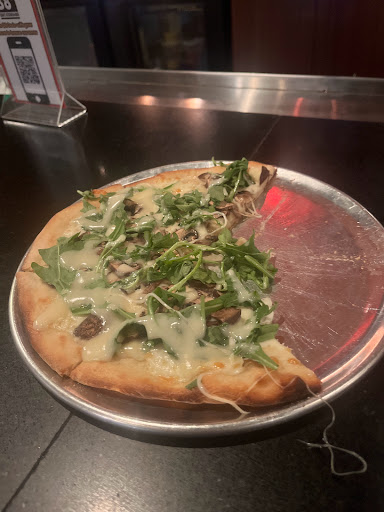 Mushroom flat bread with arugula 
