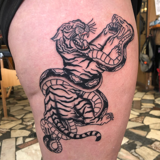 Explore black people tattoo ideas, creative tattoo ideas in New Orleans, available at Downtown Tattoos and Piercing