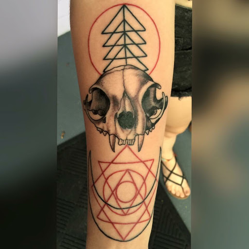 Explore dead dog tattoo ideas, creative tattoo ideas in Saint Augustine, available at Ms. Deborahs Fountain of Youth Tattoo & Body Piercing