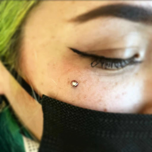 Explore tie dye tattoo ideas, creative tattoo ideas in Orange, available at Baron Art Tattoo