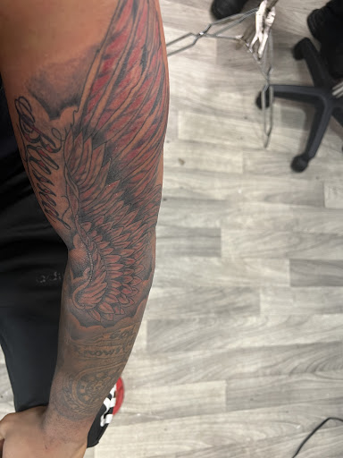 Explore rhea ripley tattoo ideas, creative tattoo ideas in Mattapan, available at Famous Touch Tattoos