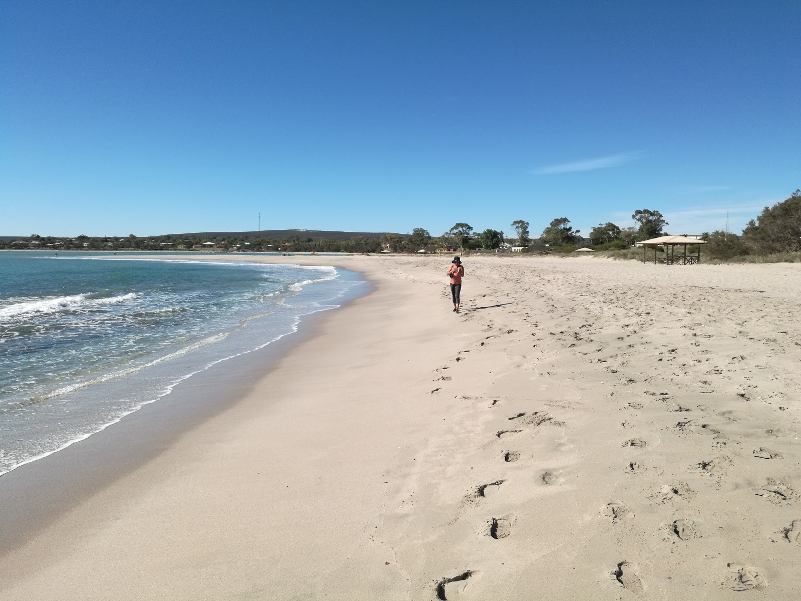 Foto van Chinaman's Beach met beige zand oppervlakte