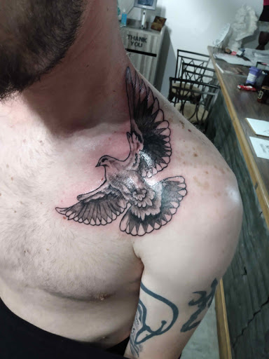 Find women's rib tattoo ideas for your next unique tattoo in Bowman at iTat Tattoo Studio