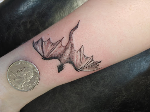 Explore catfish tattoo ideas, creative tattoo ideas in Hereford, available at Slow Pain Tattoo Body Art Studio