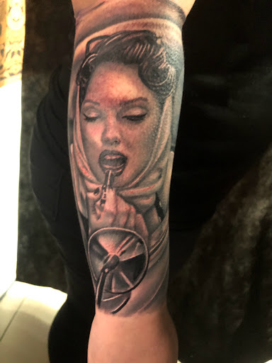 Explore face tattoo ideas for men, creative tattoo ideas in Sarasota, available at SEVEN SINS Tattoo Studio