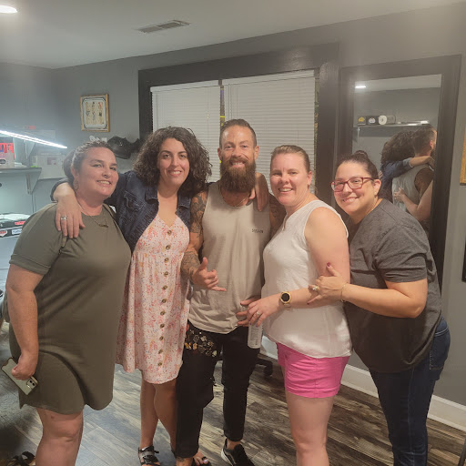 Explore thigh tattoo ideas for women, creative tattoo ideas in Charleston, available at The Edge Tattoo Studio