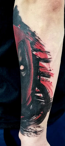 Explore rose tattoo ideas, creative tattoo ideas in Benton, available at Spectrum Tattoo