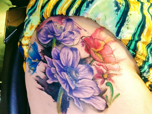 Explore cross sleeve tattoo ideas, creative tattoo ideas in Tulsa, available at Spaded and Jaded Tattoo