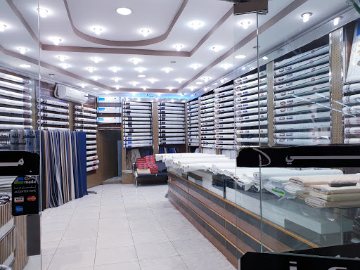 خياط لمعة دبي للخياطة الرجالية 