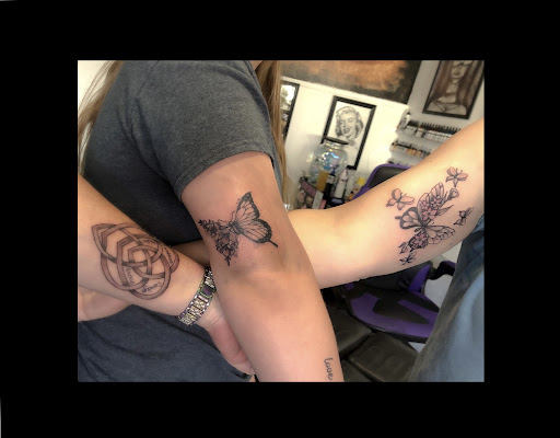 Explore feminine back tattoo ideas, creative tattoo ideas in Bowling Green, available at Ink Therapy and Body Piercing