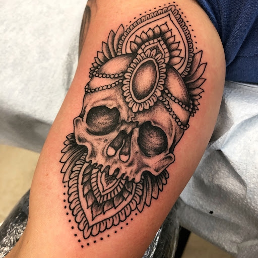 Explore women's thigh tattoo ideas, creative tattoo ideas in Lexington, available at Carolina Custom Tattoos