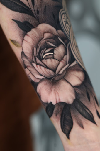 Explore small red tattoos ideas, creative tattoo ideas in Southfield, available at Enki Tattoo