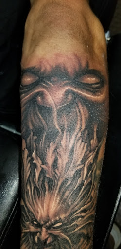 Explore cemetery tattoo ideas, creative tattoo ideas in Angola, available at Hoodlum Ink