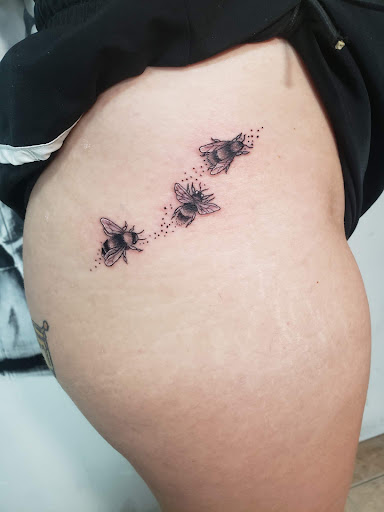 Explore rose tattoo idea, creative tattoo ideas in Decatur, available at Exclusive Ink Tattoos & Body Piercings 22nd & Wood