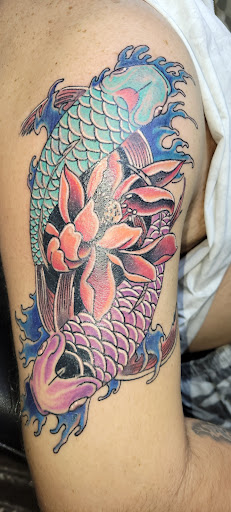 Explore race car tattoo ideas, creative tattoo ideas in Angola, available at Hoodlum Ink