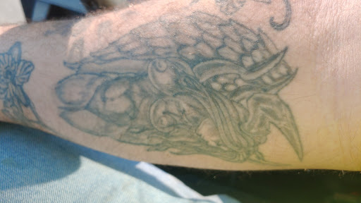 Explore griffin tattoo ideas, creative tattoo ideas in Rockford, available at Angel Tattoo