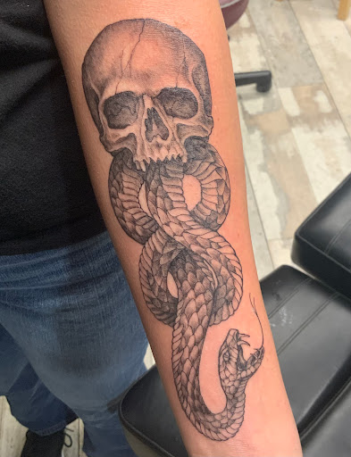 Explore womb tattoo ideas, creative tattoo ideas in Des Moines, available at Skin Kitchen Tattoo