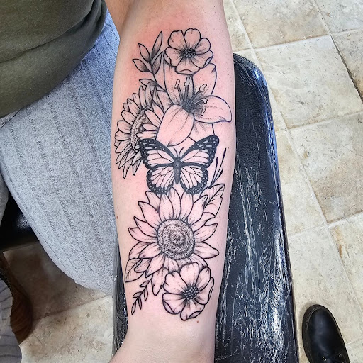 Explore wrist tattoo ideas for men, creative tattoo ideas in Abington, available at Tattoo Galaxy (Abington) Piercing and Custom Tattoos