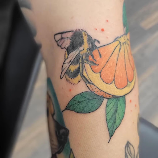 Explore olive branch tattoo ideas, creative tattoo ideas in Ocala, available at Black Lotus Tattoo & Art Gallery Inc